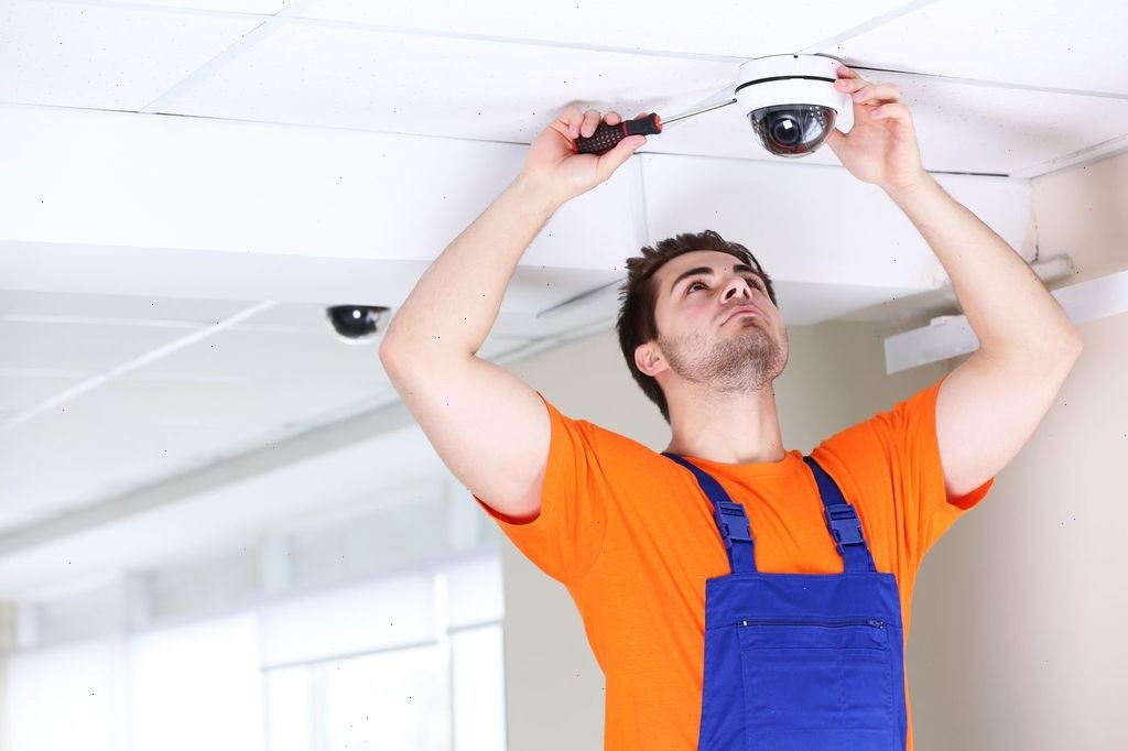 mysite-name security technician installing a camera